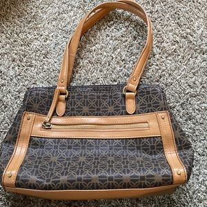 Brown and tan arm bag. Small but handy with many compartments.